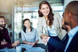Cropped shot of two business people shaking hands during a meeting in the boardroom