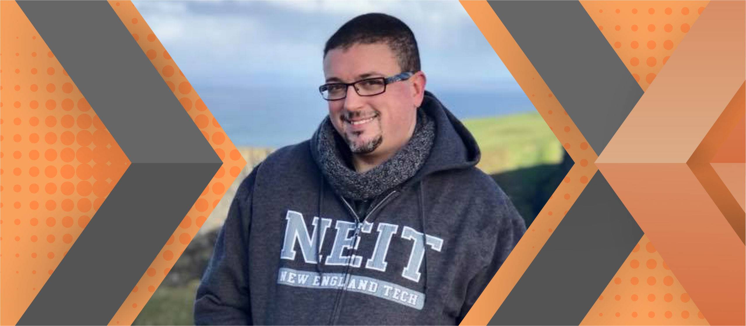 Portrait of Shaun Hazard framed by an orange and gray geometric background.