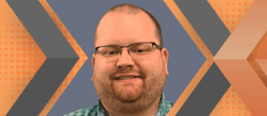 Portrait of Nick Braga framed by an orange and gray geometric background.