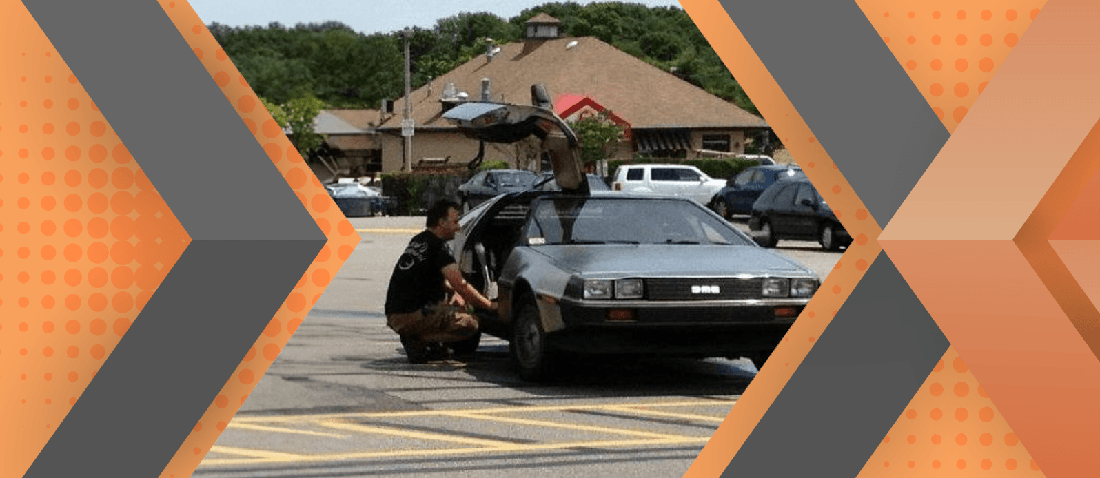 Portrait of Ben Goldsmith and his car framed by an orange and gray geometric background.