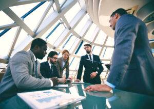 Group of business people discussing strategies at meeting