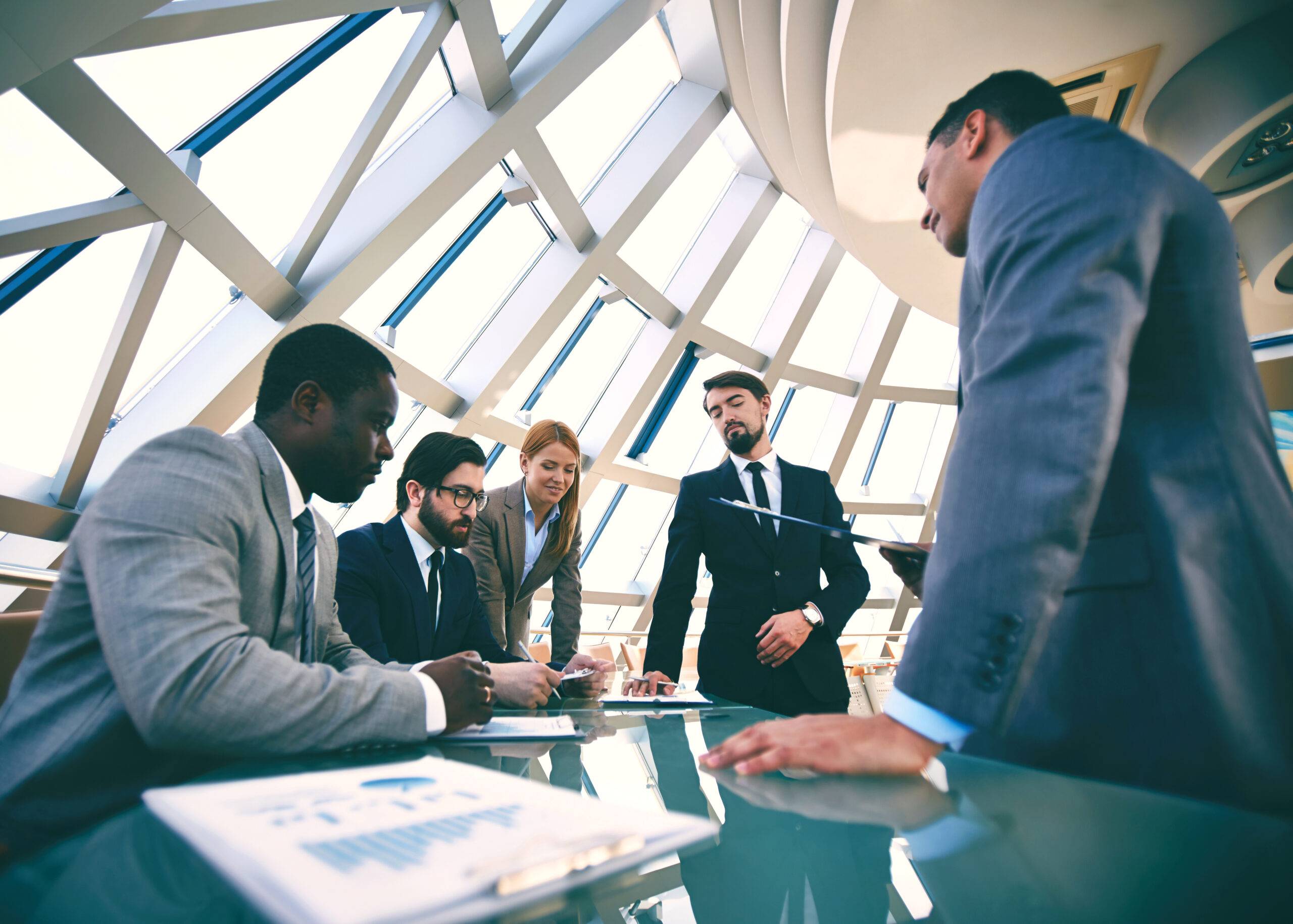 Group of business people discussing strategies at meeting