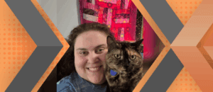 Portrait of Andrea Hellmann and her cat framed by an orange and gray geometric background.