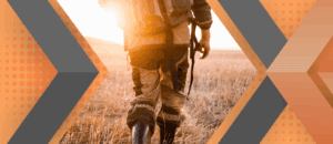 Portrait of Charles Cardella framed by an orange and gray geometric background.