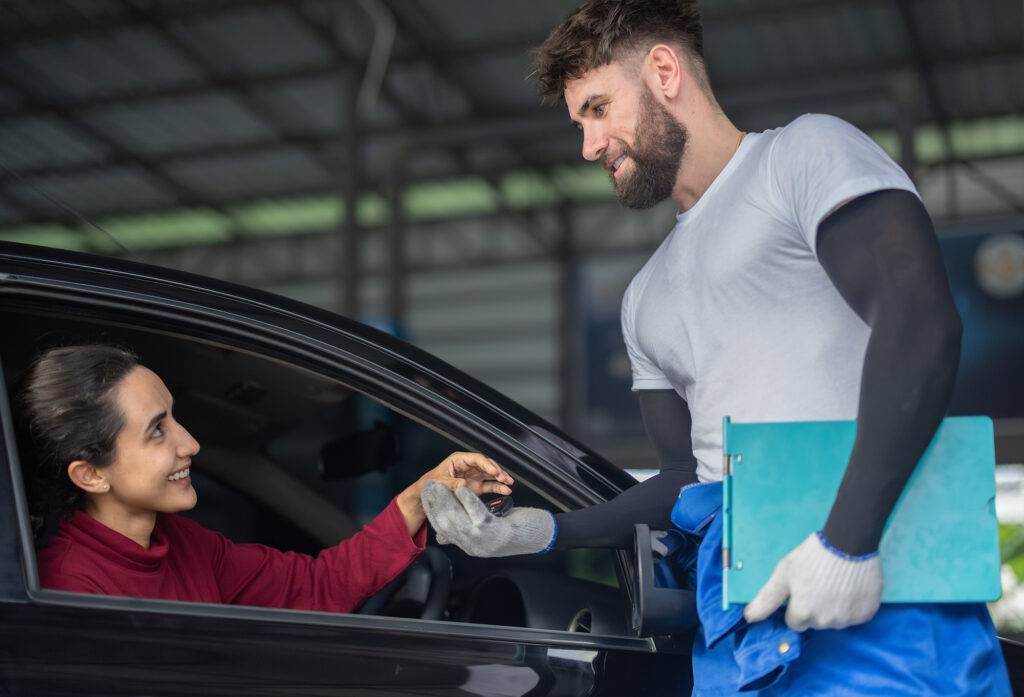 Customer interacting with subrogation specialist during vehicle claims process.